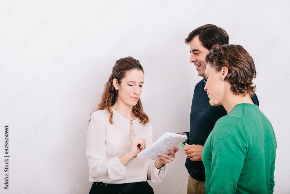 Group of office workers at a meeting around the boss Group of office workers at a meeting around the boss