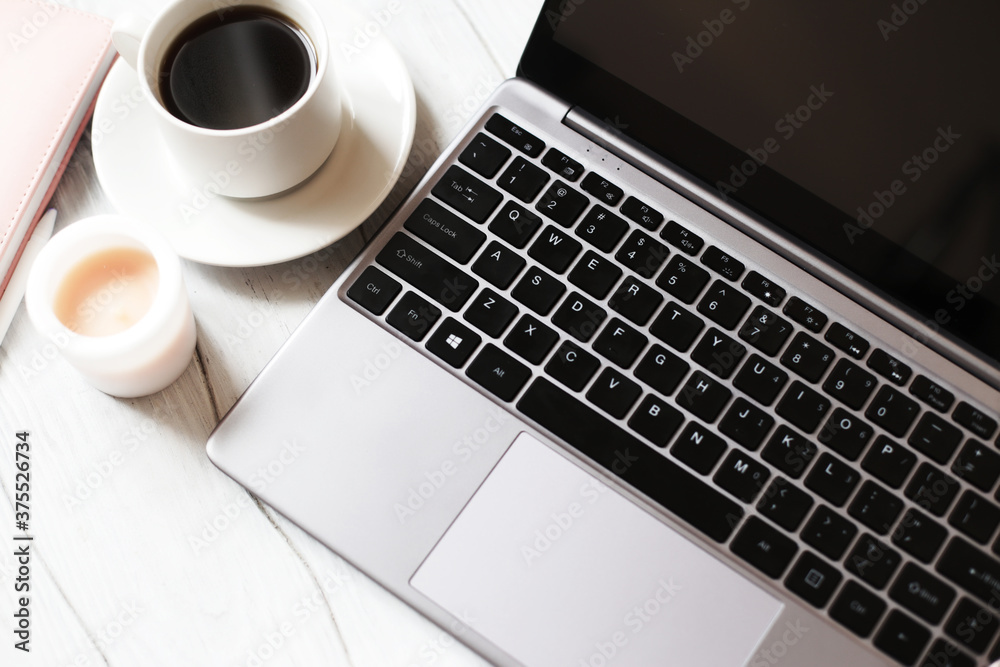 Laptop and a cup of coffee. Workplace concept. Laptop and a cup of coffee. Workplace concept.