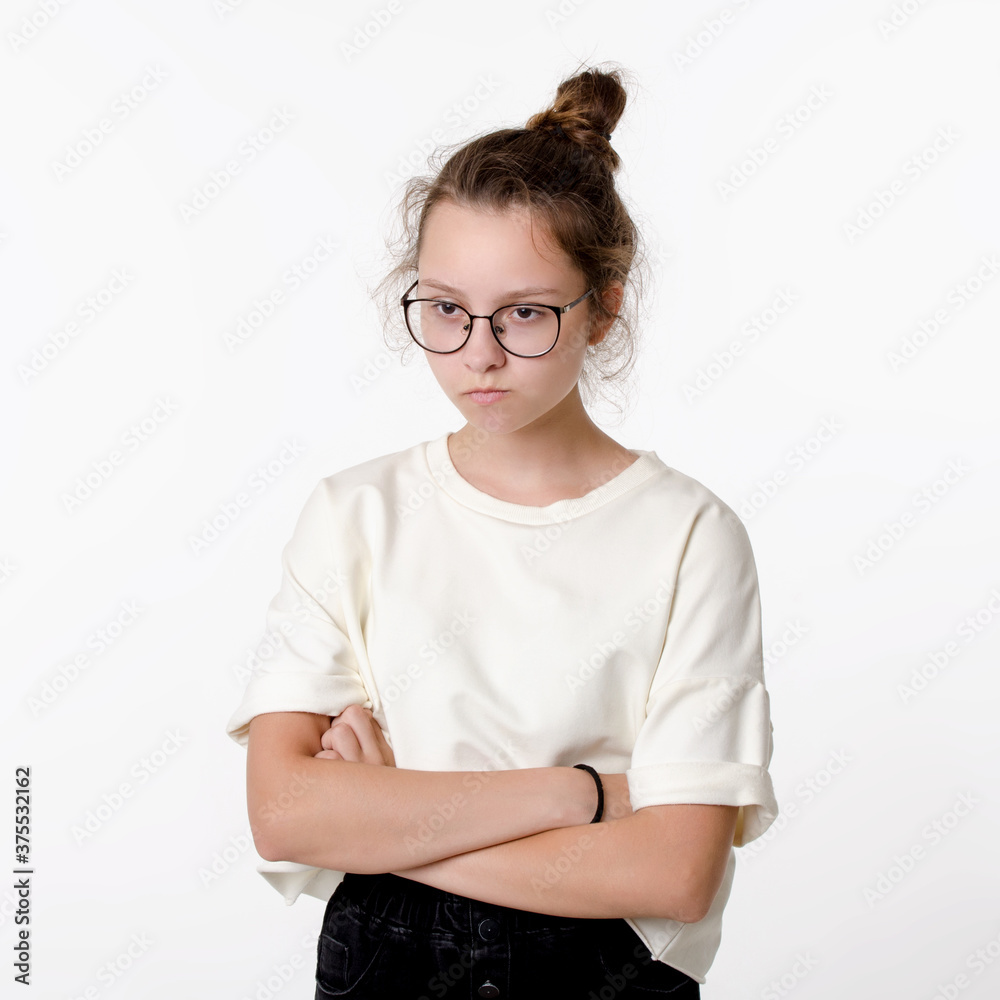 Cute сaucasian teen girl with glasses frown and take offense, portrait on white background Cute сaucasian teen girl with glasses frown and take offense, portrait on white background