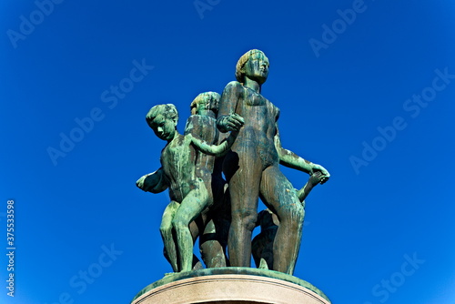 Bronze statue with green patina  resemblance of women and children dancing naked.