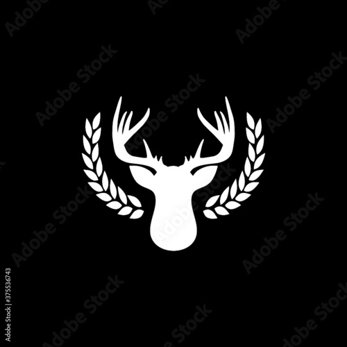 Deer head with big antlers in laurel wreath icon isolated on dark background