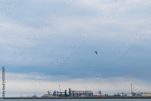 Constanta, Romania - August 14, 2019: View of Constanta Shipyard cranes and port, Romania.