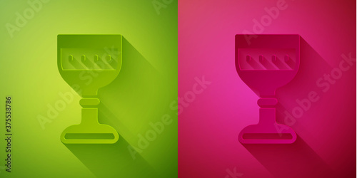 Paper cut Medieval goblet icon isolated on green and pink background. Paper art style. Vector.