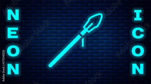 Glowing neon Medieval spear icon isolated on brick wall background. Medieval weapon. Vector.