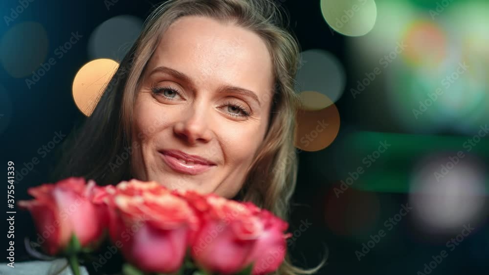 Closeup face of joyful festive girl with heap of fragrance rose flower. Shot with RED camera in 4K Closeup face of joyful festive girl with heap of fragrance rose flower. Shot with RED camera in 4K