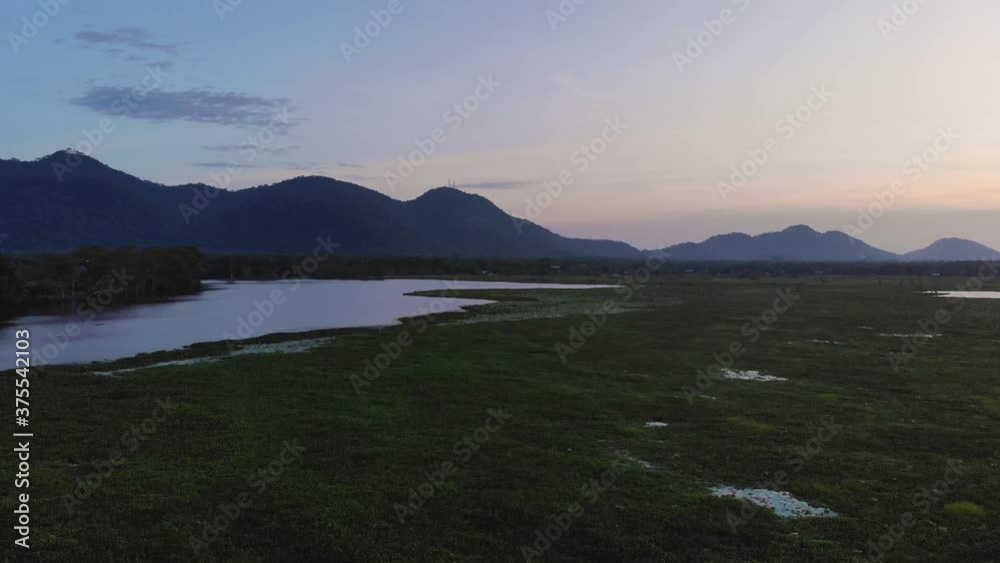 Cinematic Aerial with Mountains and a Lake in Magic Hour Cinematic Aerial with Mountains and a Lake in Magic Hour