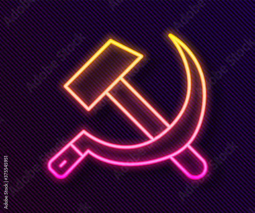 Glowing neon line Hammer and sickle USSR icon isolated on black background. Symbol Soviet Union. Vector.