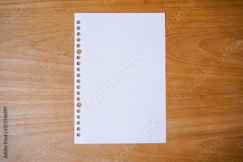 blank paper for mockup concept on wooden board. finance, education background