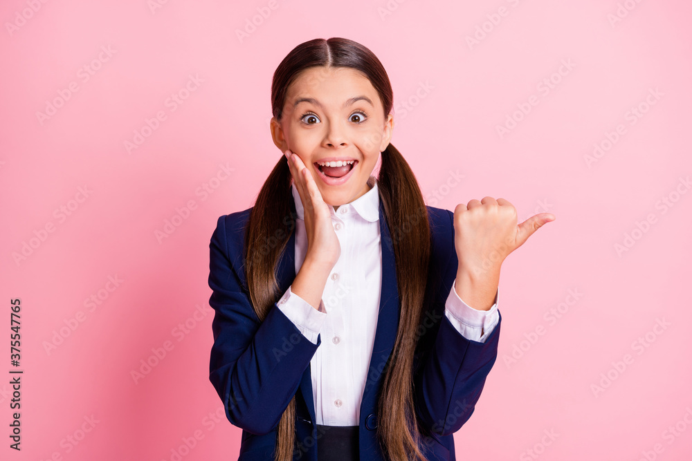 Portrait of her she nice attractive cheerful amazed glad girl pointing thumb advert ad copy space look idea good new solution advice isolated over pink pastel color background Portrait of her she nice attractive cheerful amazed glad girl pointing thumb advert ad copy space look idea good new solution advice isolated over pink pastel color background