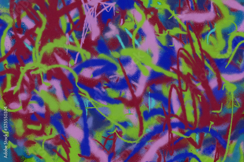 Colorful spray paint ink texture. Graffiti painting on the wall. Street art and vandalism. Digitally airbrushed paper background.  © artistmef
