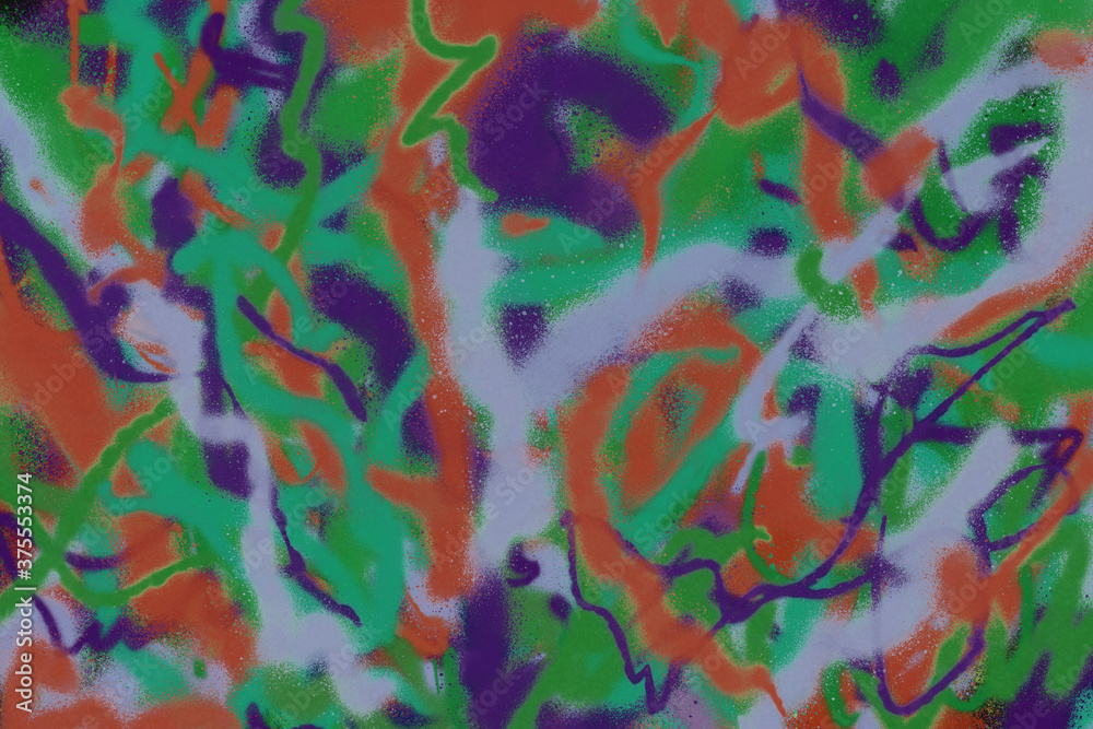 Colorful spray paint ink texture. Graffiti painting on the wall. Street art and vandalism. Digitally airbrushed paper background.