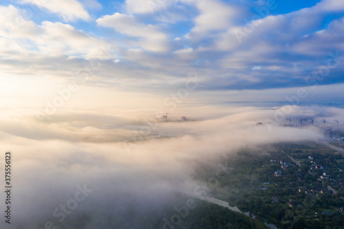 A thick fog spreads over the city! In the distance you can see high-rise buildings and a construction crane! © Eraqusty