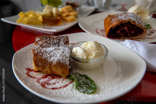 still life with coffee service breakfast on a red tablecloth