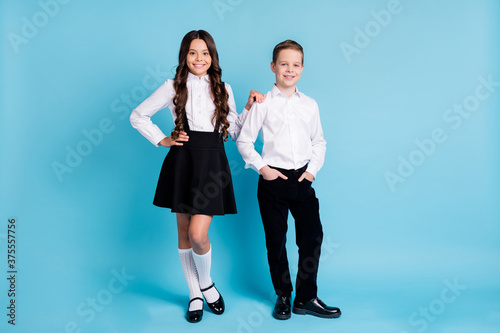Wallpaper Mural Full body size photo of two girl boy model schoolchildren smiling hands pockets