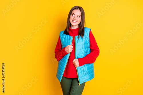 Photo of cheerful curious girl touch her season autumn clothing look copyspace imagine black friday ads isolated over vivid color background