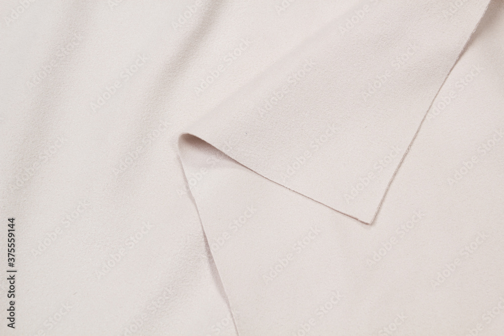 Ocher matte background of suede fabric, closeup. Velvet texture of seamless leather. Ocher matte background of suede fabric, closeup. Velvet texture of seamless leather.