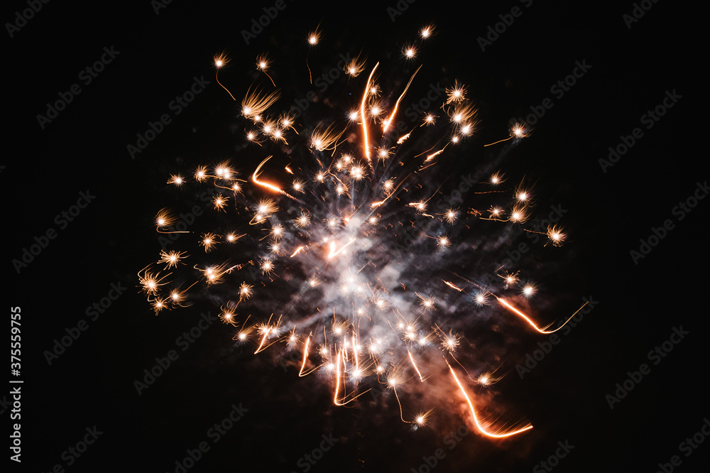Fireworks in Happy New Year 2020. Holiday festival celebration. Fireworks display on dark sky background. Fireworks in Happy New Year 2020. Holiday festival celebration. Fireworks display on dark sky background.