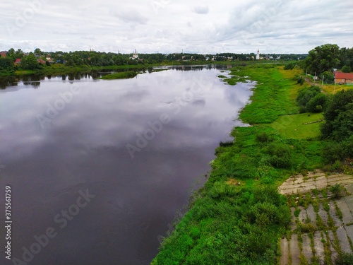 Rural landscape the village is a wige calm river