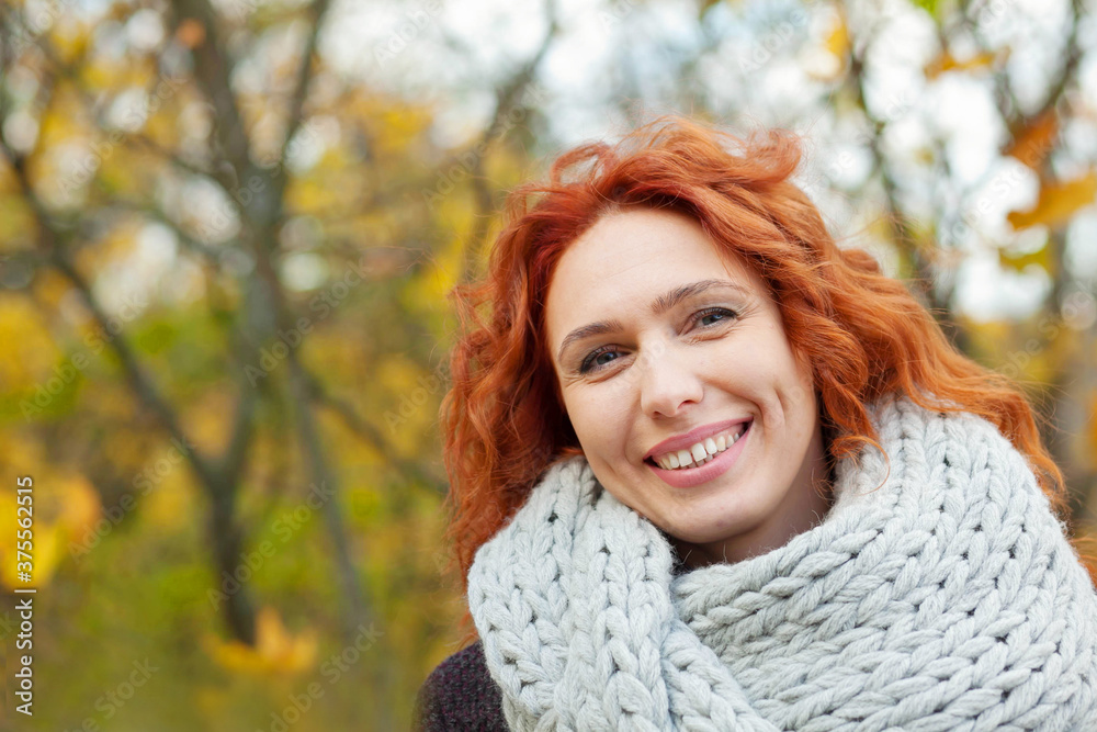 Happy smiling woman with yellow leaves outdoors. Autumn mood. Happy smiling woman with yellow leaves outdoors. Autumn mood.
