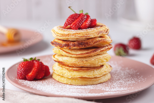 Delicious, only baked pancakes with fresh aromatic strawberries