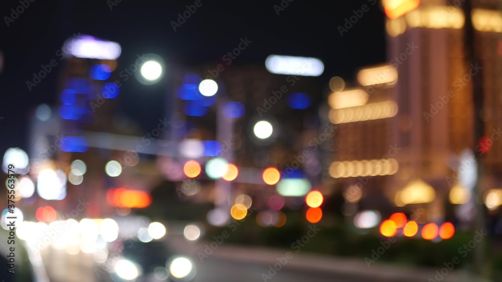 Defocused fabulous Las Vegas Strip boulevard, luxury casino and hotel, gambling area in Nevada, USA. Nightlife and traffic near Fremont street in tourist money playing resort. Neon lights of sin city