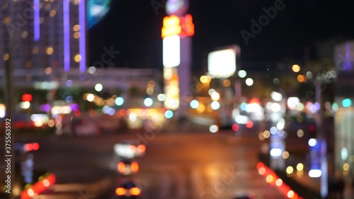 Defocused fabulous Las Vegas Strip boulevard, luxury casino and hotel, gambling area in Nevada, USA. Nightlife and traffic near Fremont street in tourist money playing resort. Neon lights of sin city