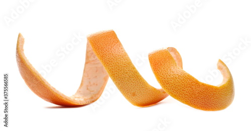 Swirly grapefruit peel curl isolated on white background