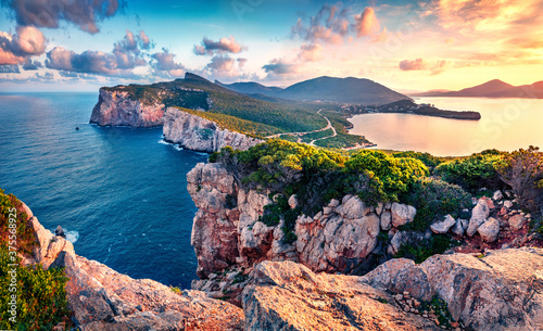 Exciting morning view of Caccia cape. Nice spring sunrise on Sardinia island, Italy, Europe. Great morning seascape of Mediterranean sea. Beauty of nature concept background. photo