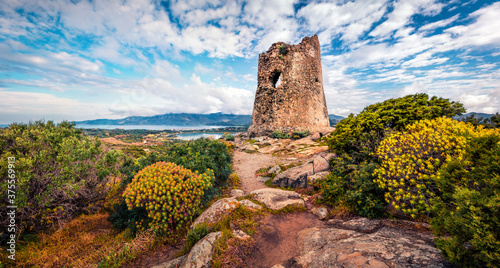 Fototapeta Naklejka Na Ścianę i Meble -  Splendid spring scene of Torre di Porto Giunco tower on Carbonara cape. Stunning morning view of Sardinia island, Italy, Europe. Gorgeous Mediterranean seascape.