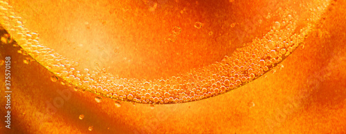 abstract light orange background with oil circles . oil bubbles of water close. fiery circle bubbles background. banner