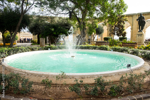 The Barrakka Gardens in Valletta, Malta, with cozy benches and beautiful fountain are a great place for relaxation and promenade
