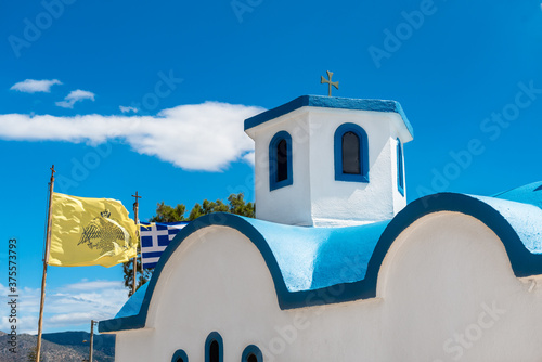 The lement of traditional greek orthodox church with blue roof and white walls,  photo