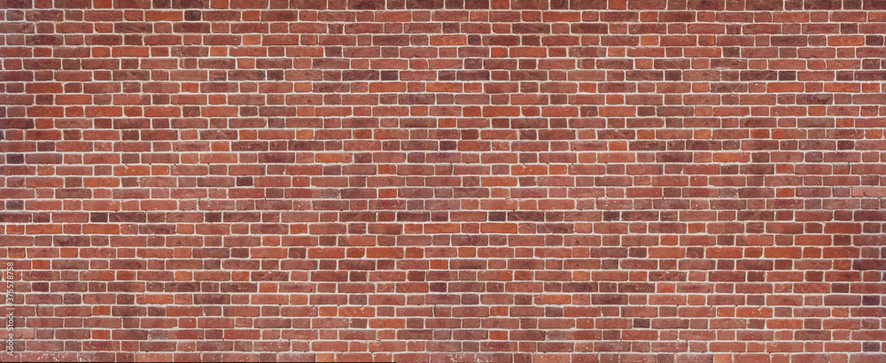 Panoramic background of wide old red and brown brick wall texture. Home or office design backdrop. Panoramic background of wide old red and brown brick wall texture. Home or office design backdrop.
