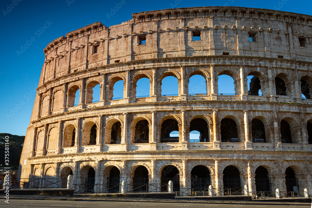 The Colosseum in Rome at sunrise, Italy