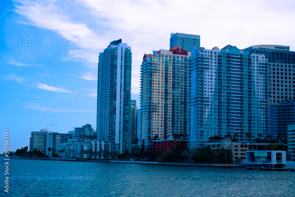 Naklejka premium Buildings next to the Miami South Channel in Brickell Miami, Florida, Skyline of Brickell near the the Miami South Channel, Buildings on Brickell Ave during the daytime, Apartments in Brickell, City