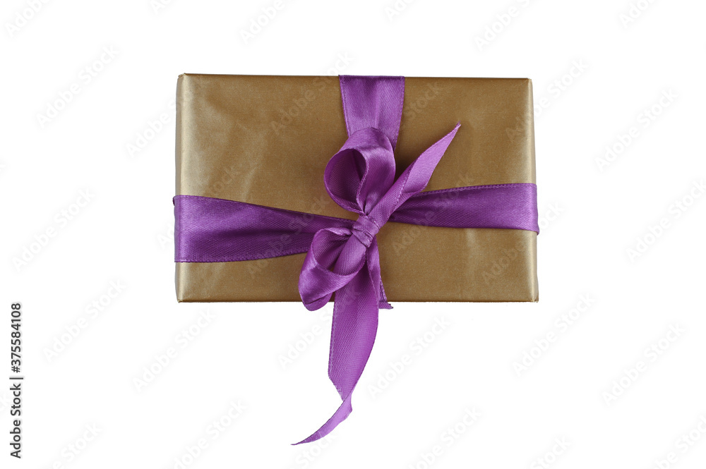 Brown gift wrap with purple bow on isolated background Brown gift wrap with purple bow on isolated background