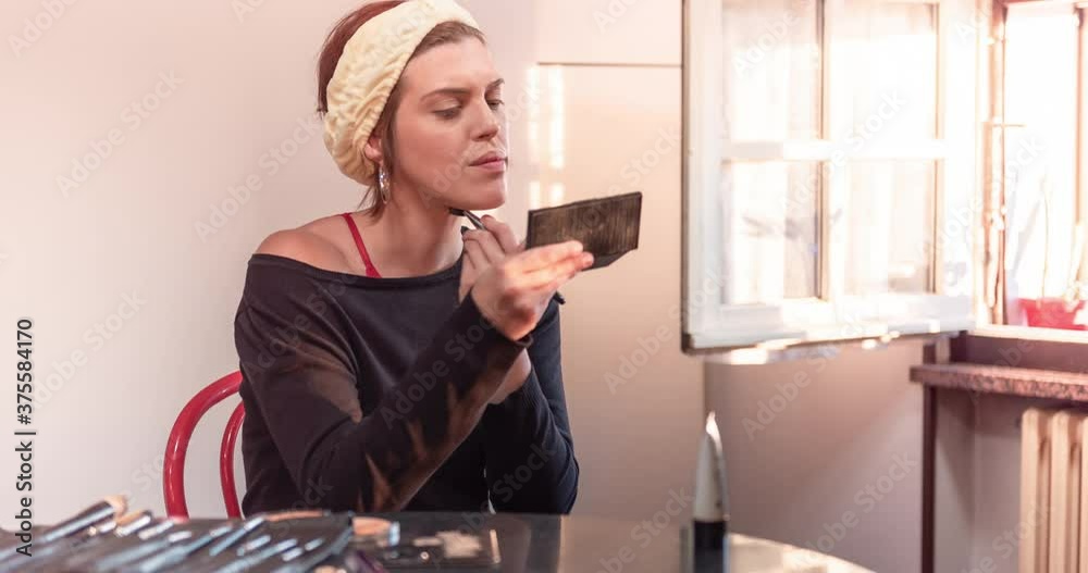 Beautiful woman does makeup in front of the mirror. 4K Video Time Lapse Beautiful woman does makeup in front of the mirror. 4K Video Time Lapse