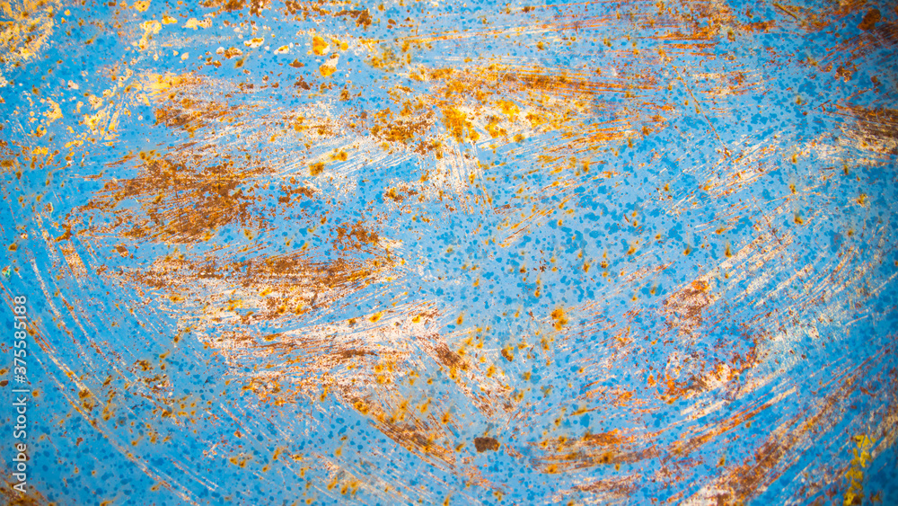 Old natural rusty metal sheet metal plate with peeling blue paint, beautiful background