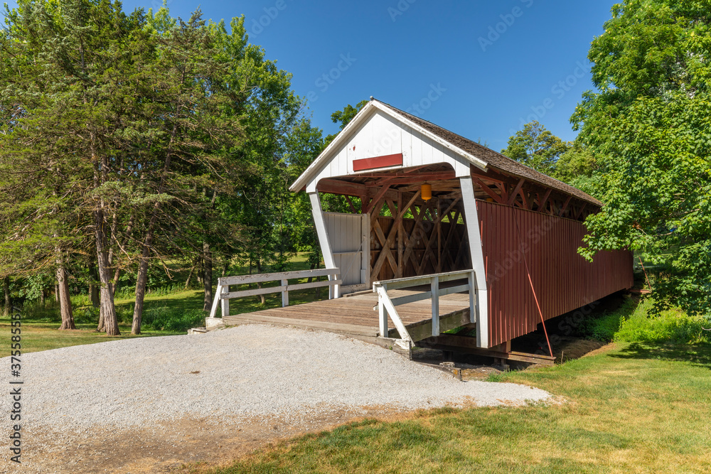 An Old Red And White Covered Bridge