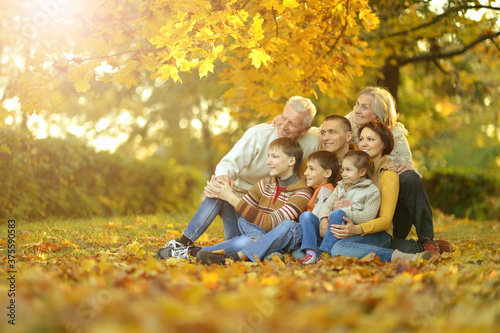 Big family having fun together in autumnal park