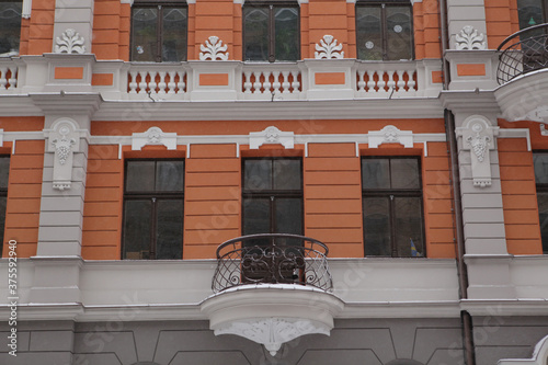 Detail of house on Baznicas street, 4a, Riga, city, Latvia, Europe. Ancient architecture with stucco molding, mascarons on old building facade. Art nouveau style. Riga landmark, monument photo