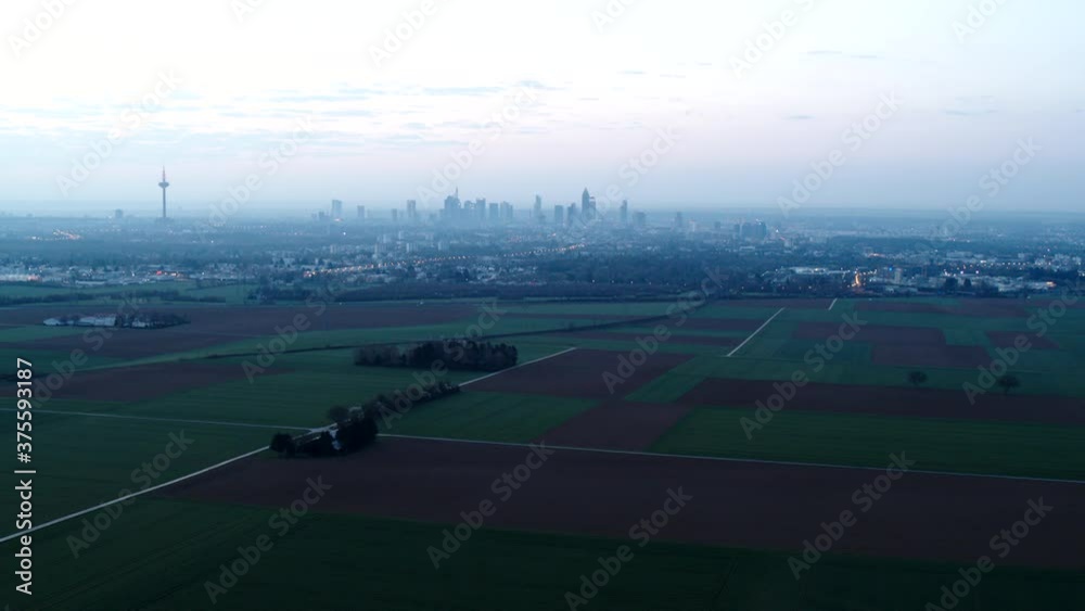 Scenic view agricultural fields and cityscape, Frankfurt, Hesse, Germany Scenic view agricultural fields and cityscape, Frankfurt, Hesse, Germany