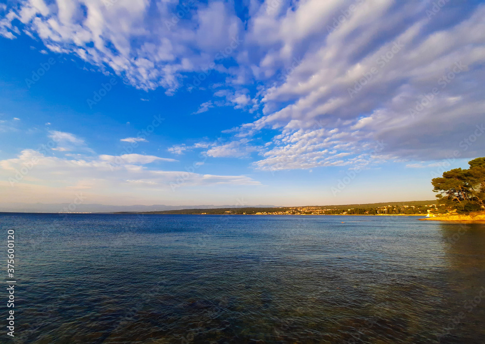 View of Adriatic sea, coast and blue sky whit white clouds