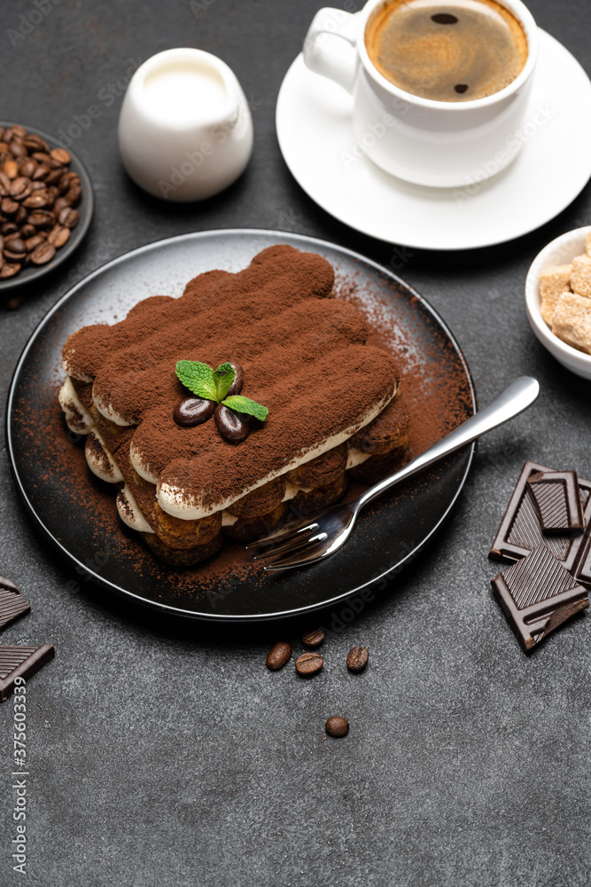 Classic tiramisu dessert, cup of coffee, sugar and milk on concrete background
