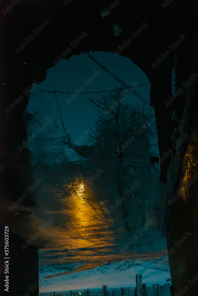 Naklejka Reflections on a wet road, rainy sad autumn view