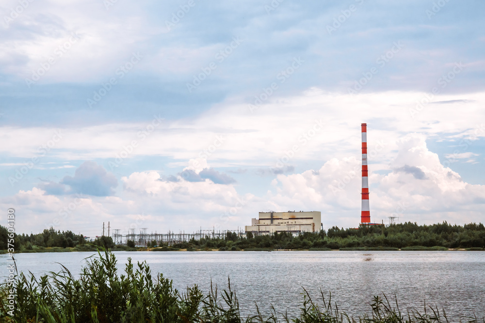 Combined heat and power plant and a lake with cooling fountains. CHP for the production and supply of the city's population with electricity and hot central water supply. Technology and nature