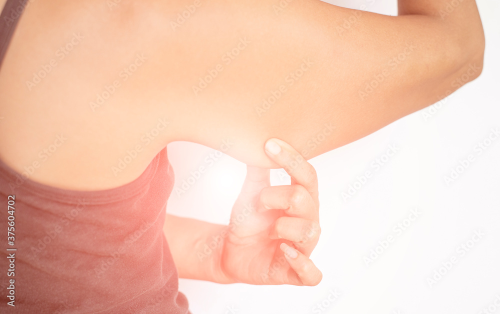 Picture of woman gesture showing back muscles, under arms, with fat under the skin.