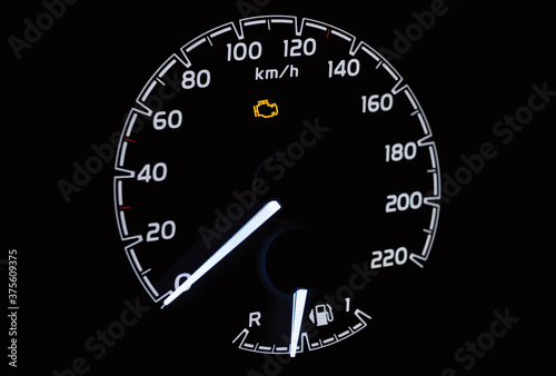 Malfunction check engine warning light on car dashboard. Vector illustration of side view of modern car instrument panel with speedometer and fuel gauge.