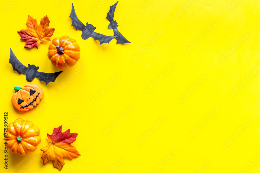 Halloween holiday banner design - pumpkins, cookies and autumn leaves, top view Halloween holiday banner design - pumpkins, cookies and autumn leaves, top view