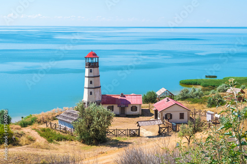 khutor Merzhanovo, Rostov region, Russia - August 3, 2020: Taganrog Bay of the Azov Sea, view of the lighthouse photo